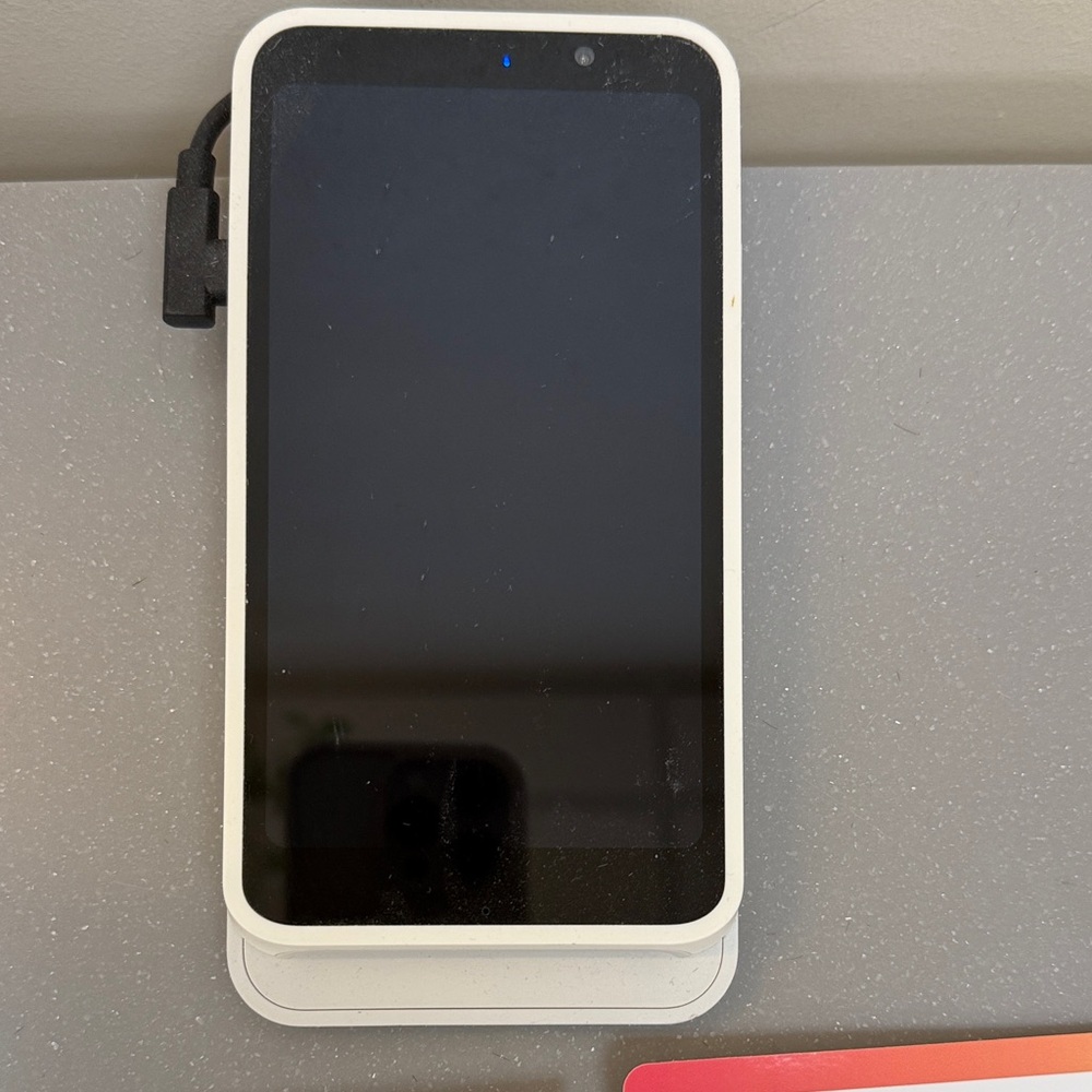 Sleek Black Smartphone with White Frame